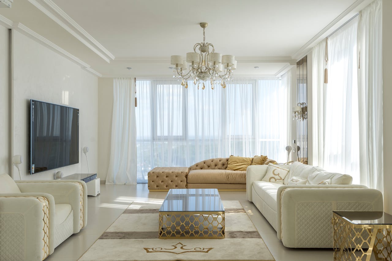 The Art of Drawing Readers In: Your attractive post title goes here Interior of spacious room with huge windows behind curtains and comfortable furniture against TV set